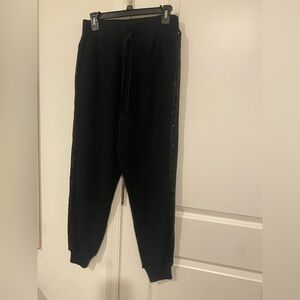 Black knit sweater Pants set with Sequin Details and a matching top.